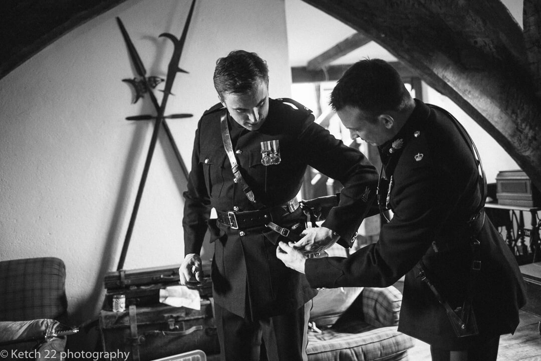 Groomsmen in army uniform getting ready 