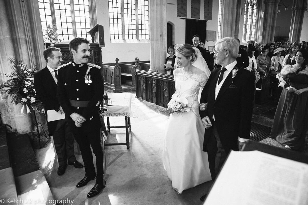 Bride and groom look at eachother for first time at wedding ceremomy