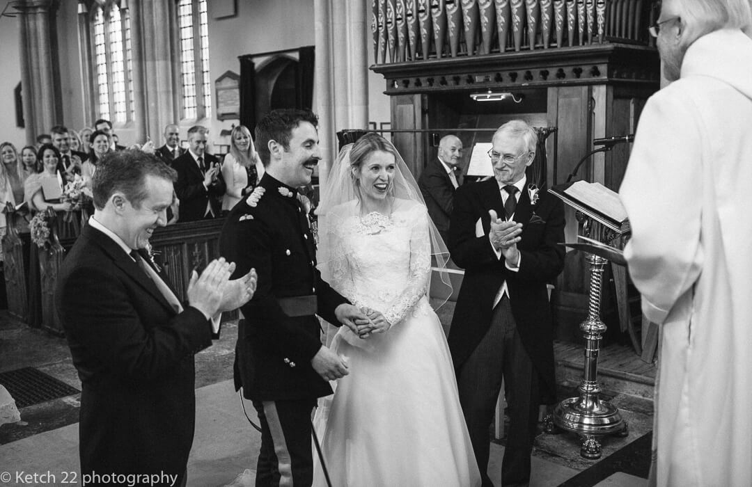 Bride and groom laughing at wedding cremony