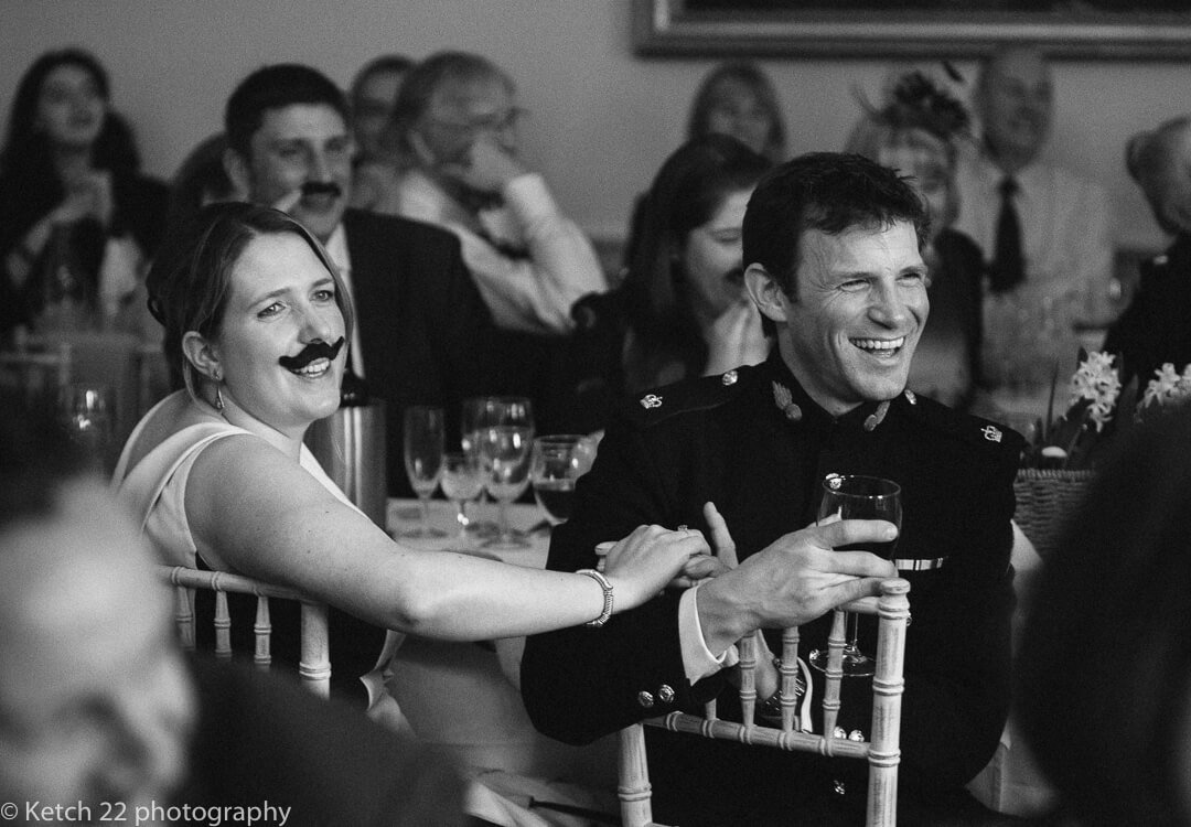 Wedding guests reacting to speeches