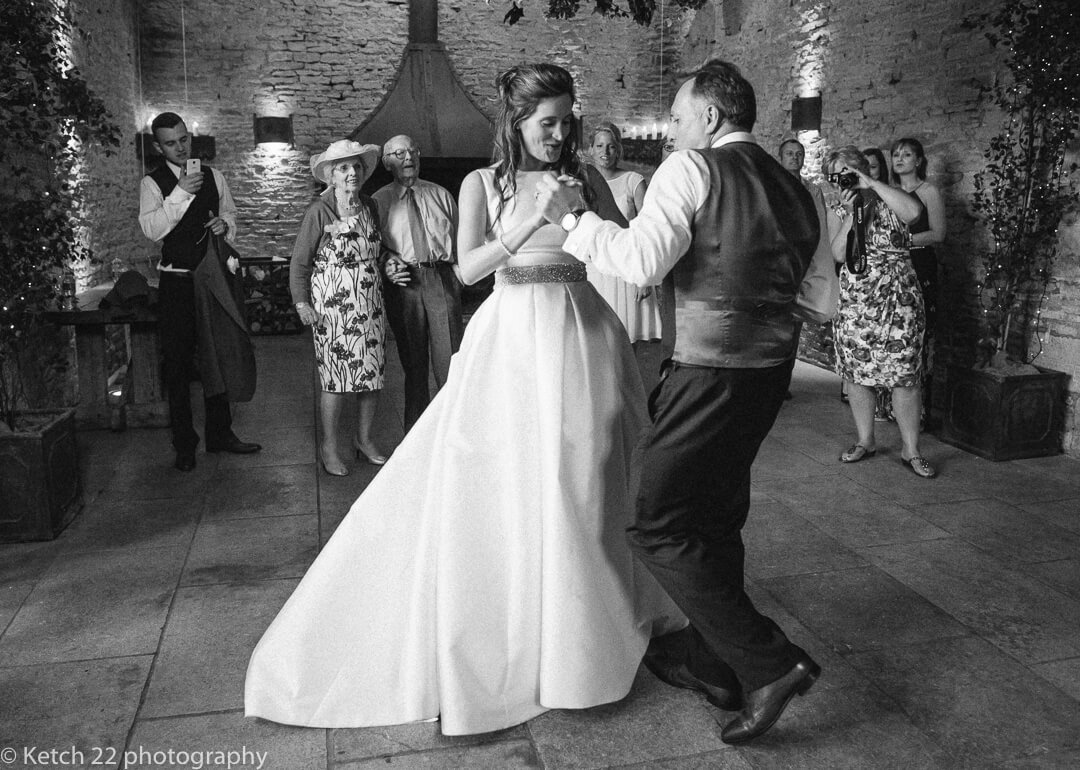 Bride and groom at first dance at barn wedding in Gloucestershire