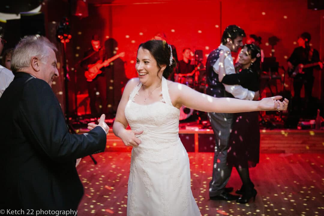 Bride dancing with father at wedding reception