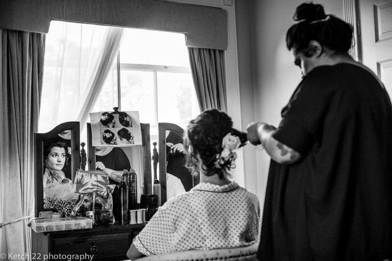 Bridesmaid having hair done at Dorset Sumer wedding