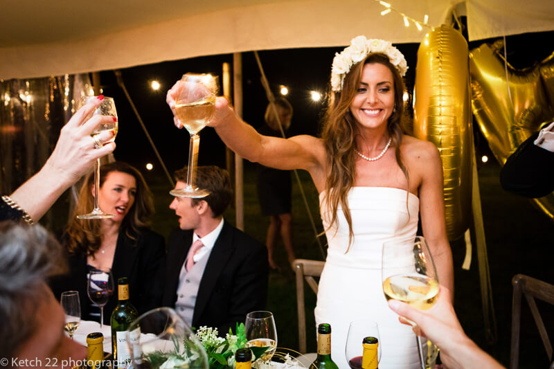 Bride toasting at Dorset summer wedding