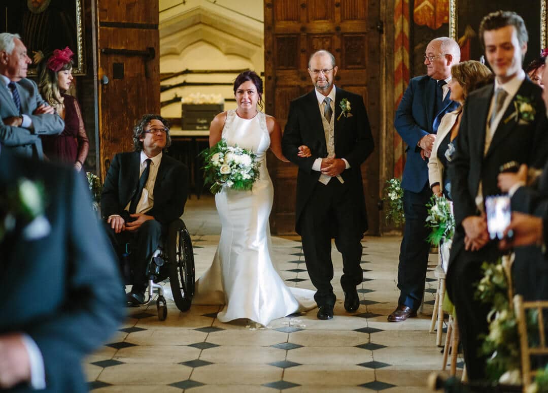 Bride and father walking down aisle at Gloucestershire wedding
