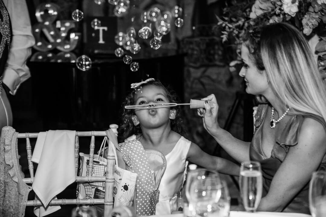 Flower girl blowing bubbles