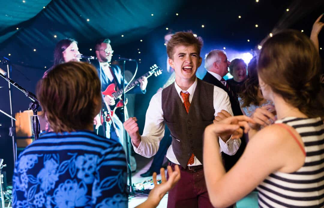 Wedding guests dancing at reception