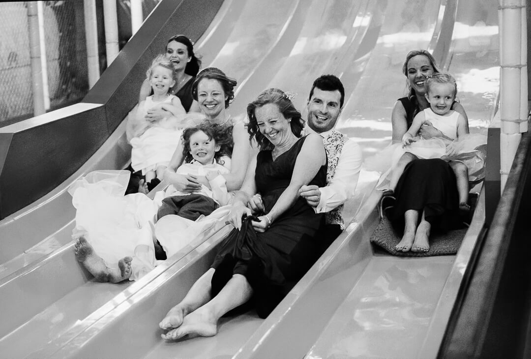 Bridal party on a big slide at The Barn at Berkeley