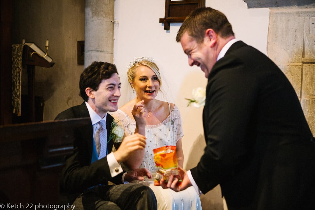 Bride and groom eating sweets at wedding ceremony