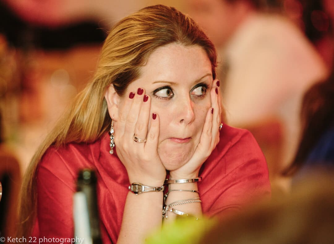 Wedding guest makes quirky face during the speeches