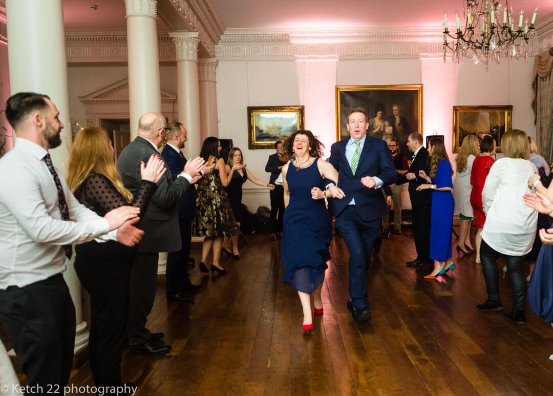 Wedding guests dancing at country house in Somerset