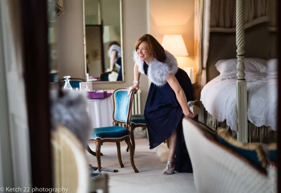 Bridesmaid getting ready for a reportage wedding at North Cadbury Court in Somerset