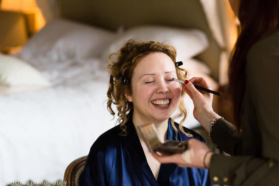 Bride getting ready at preparations at candid wedding 