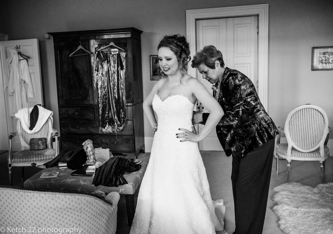 Bride at final preparations at country house wedding