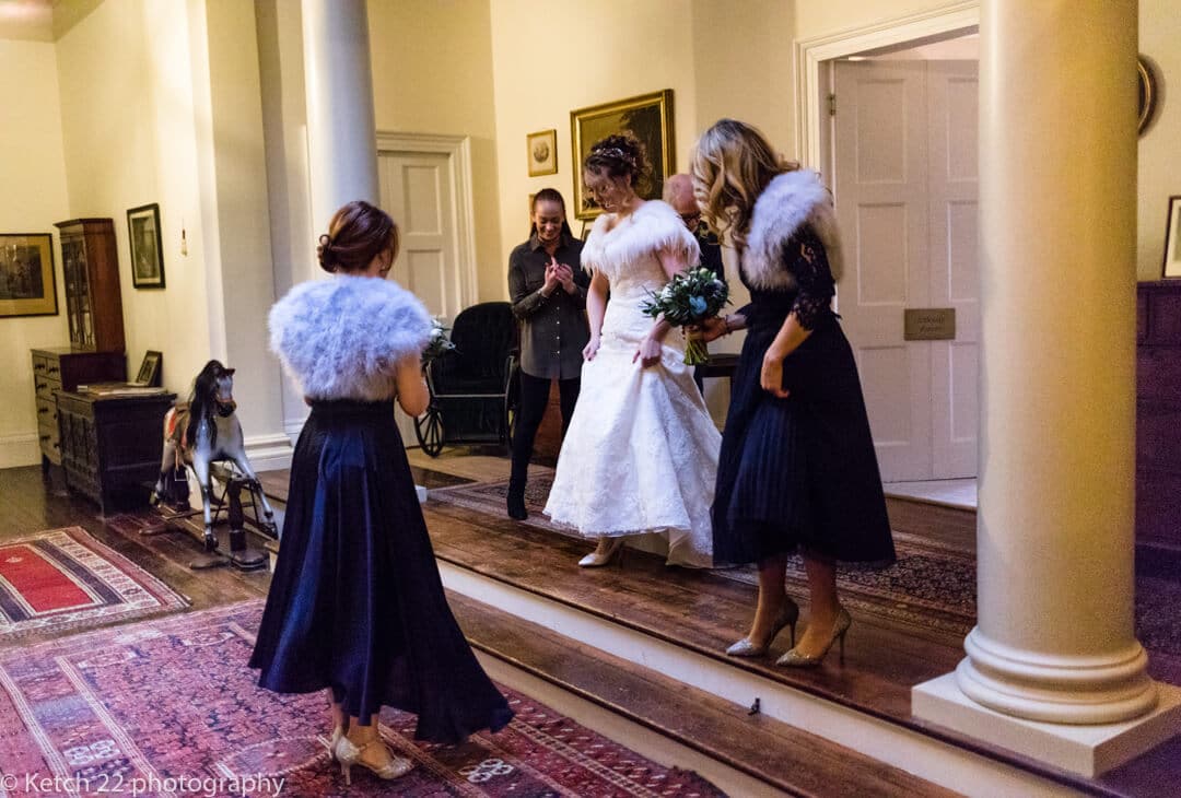 Bride walking through corridor at Country House wedding