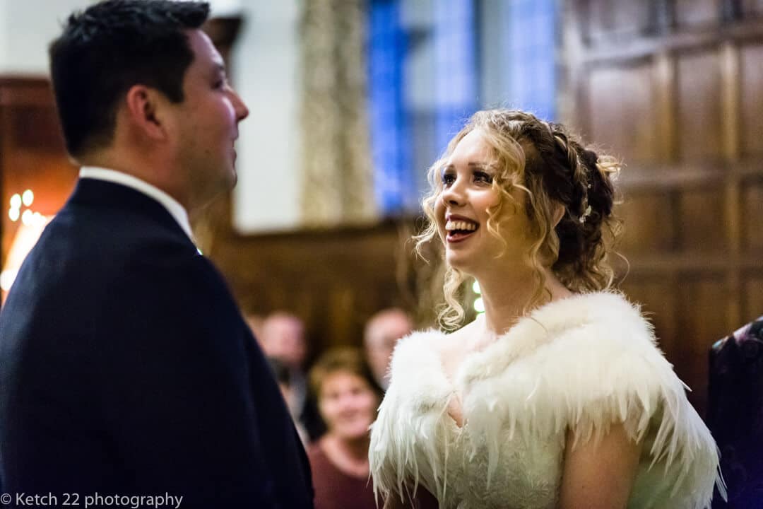 Storytelling wedding photo of bride and groom taking vows at wedding ceremony