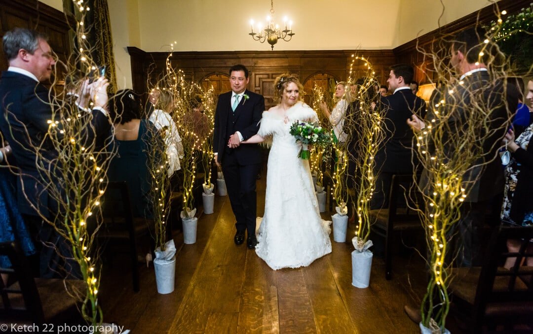 Bride and groom walking down aisle at North cadbury Court wedding