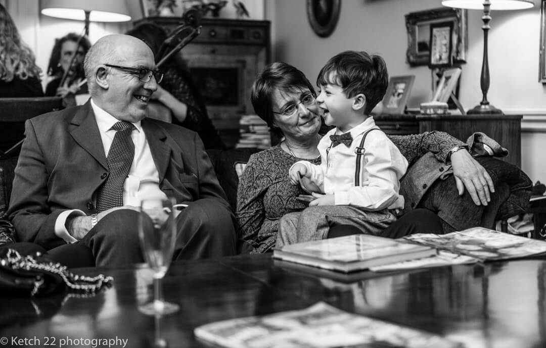 Documentary wedding photo of little boy with family 