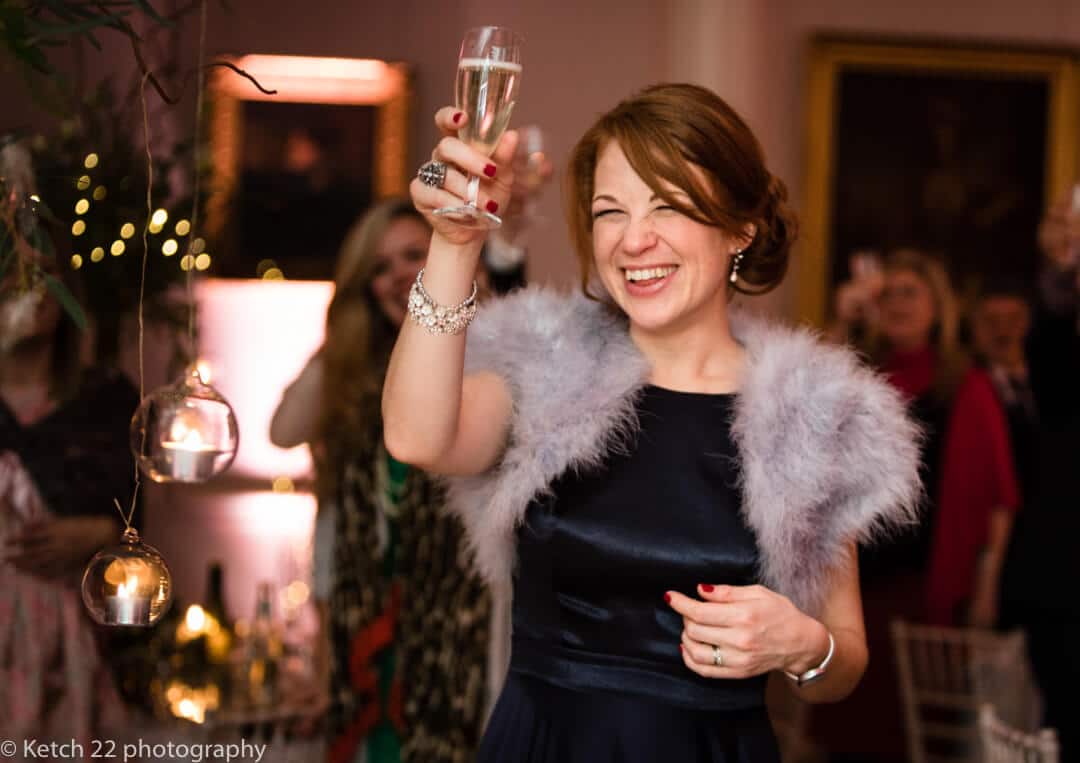 Bridesmaid toasting the bride and groom at wedding speeches