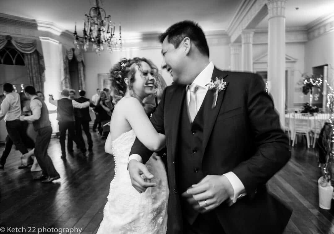 Reportage wedding photography of bride and groom dancing