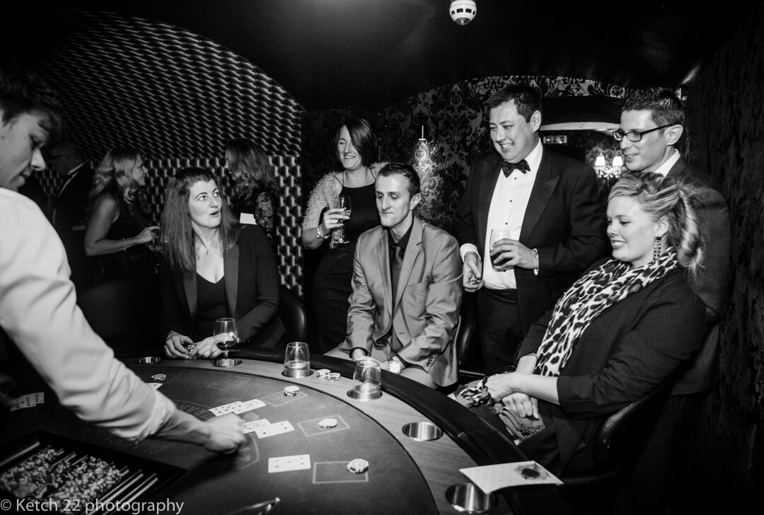 Wedding guests playing cards at North Cadbury Court casino