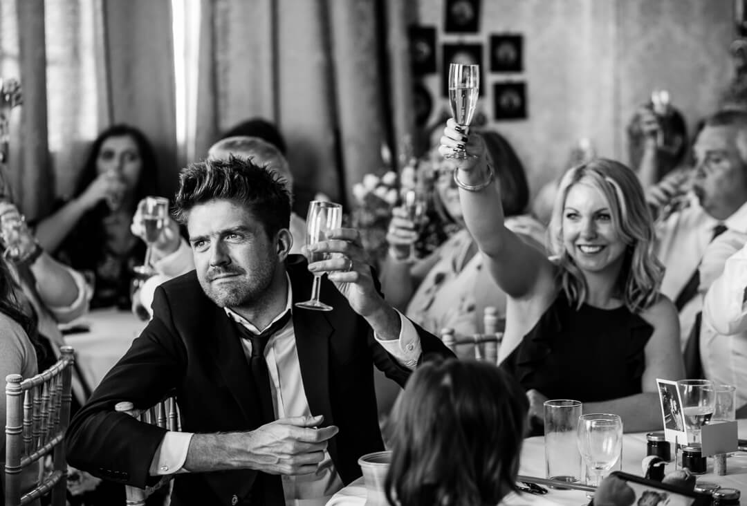 Wedding guests reacting to speeches