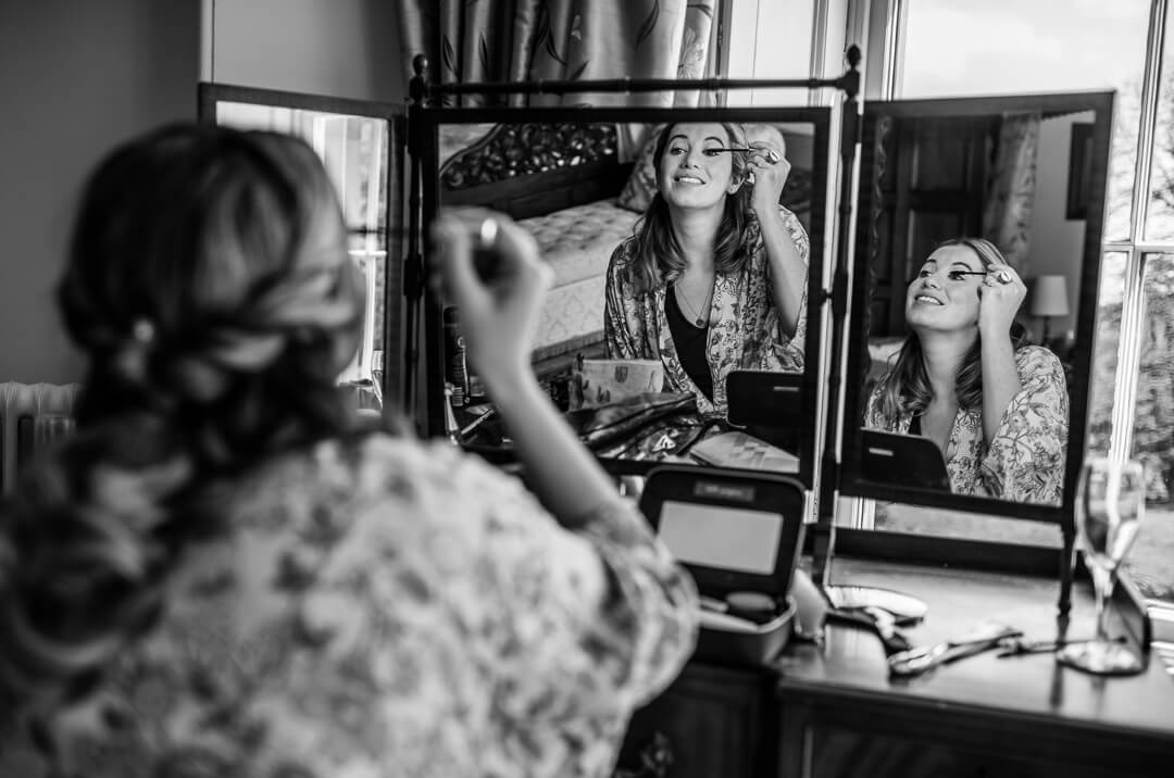 Documentary wedding photograph of bridesmaid getting ready 