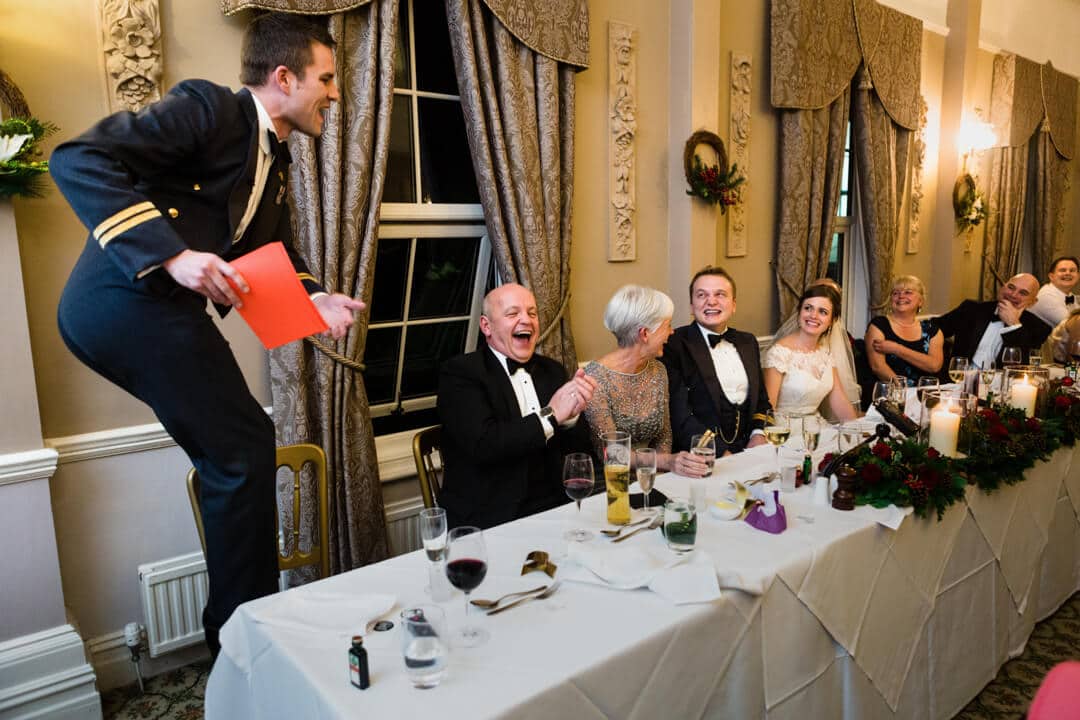 Best man getting up to antics during speeches at Winter Welsh Wedding