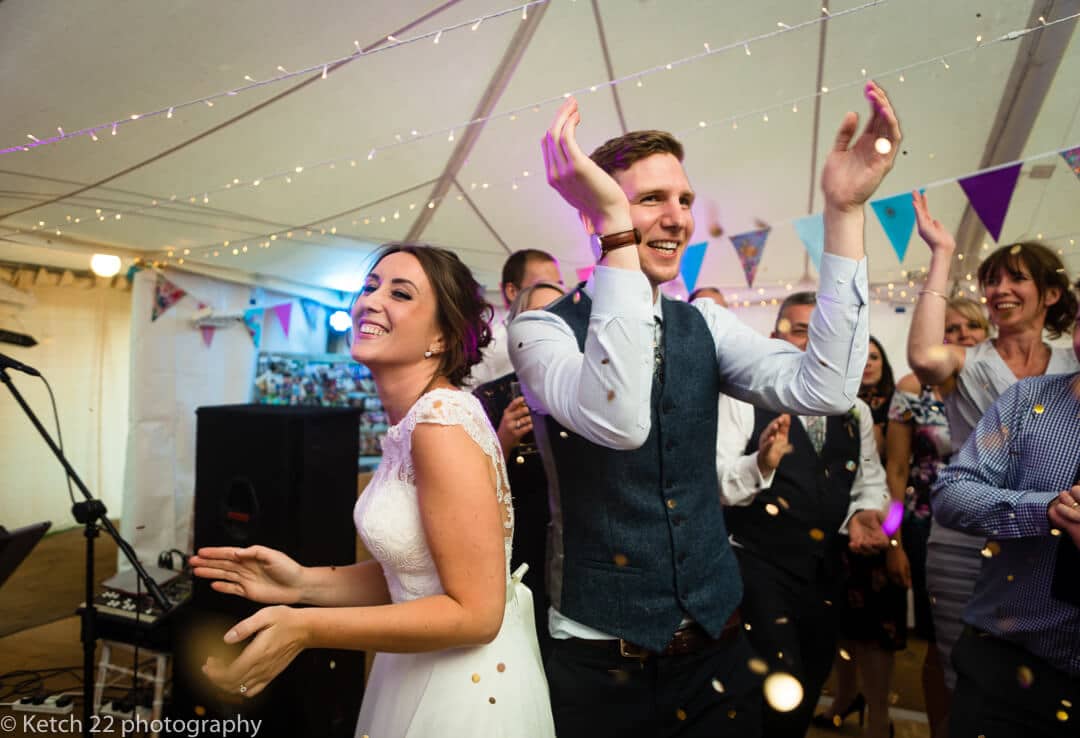 Bride and groom clapping at first dance for Marquee wedding