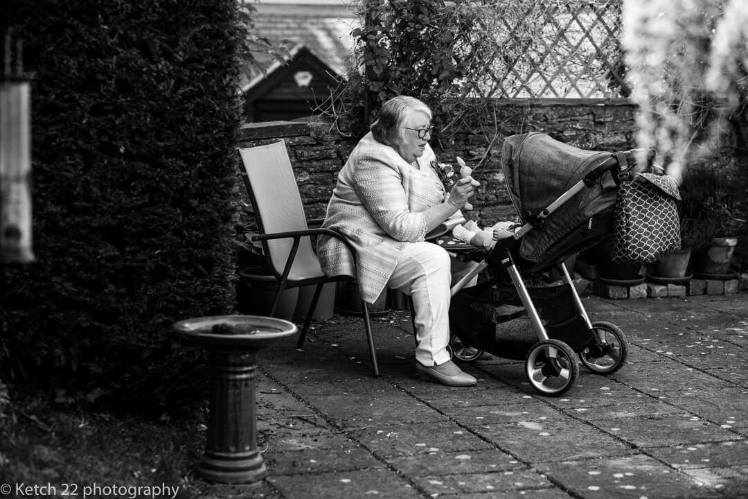 Grandma looking after baby at Reportage wedding