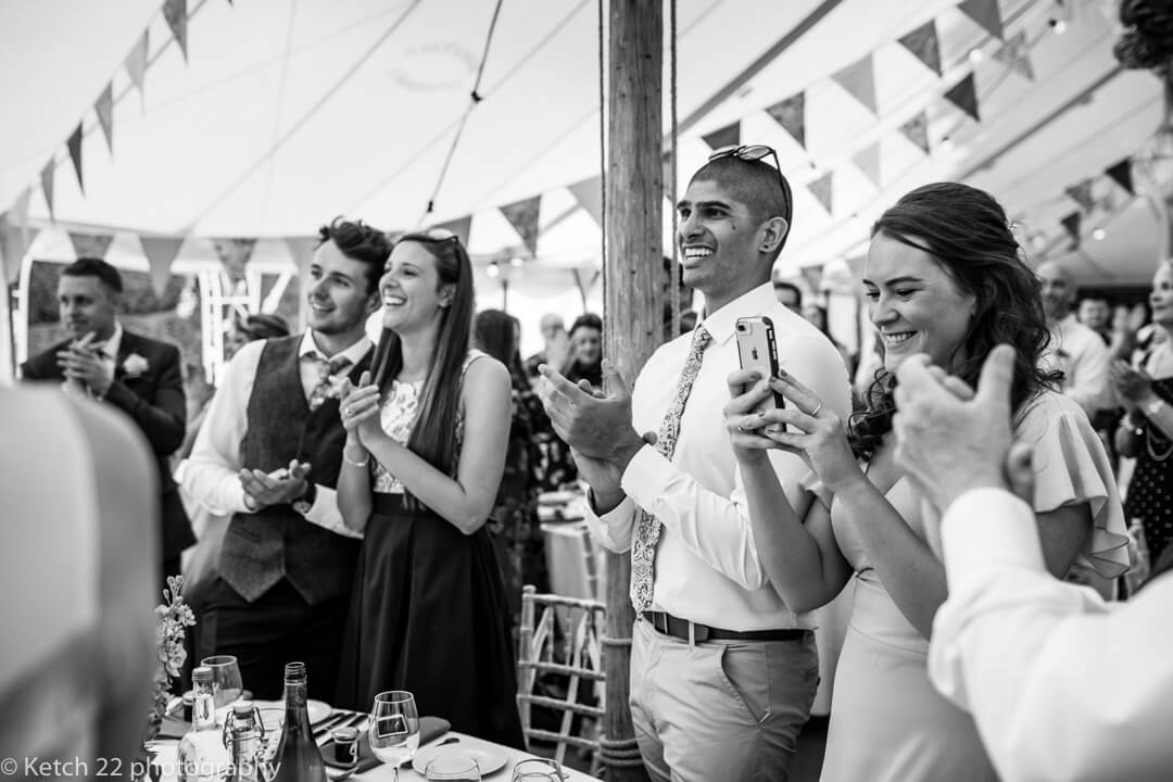 Wedding guests clapping at Marquee wedding