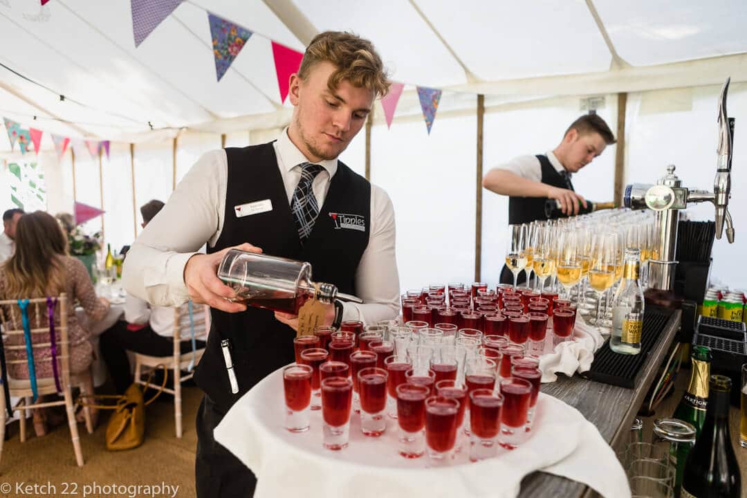 Barman pouring drinks at Herefordshire wedding