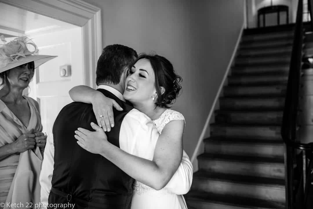 Bride hugging her Dad just before wedding ceremony