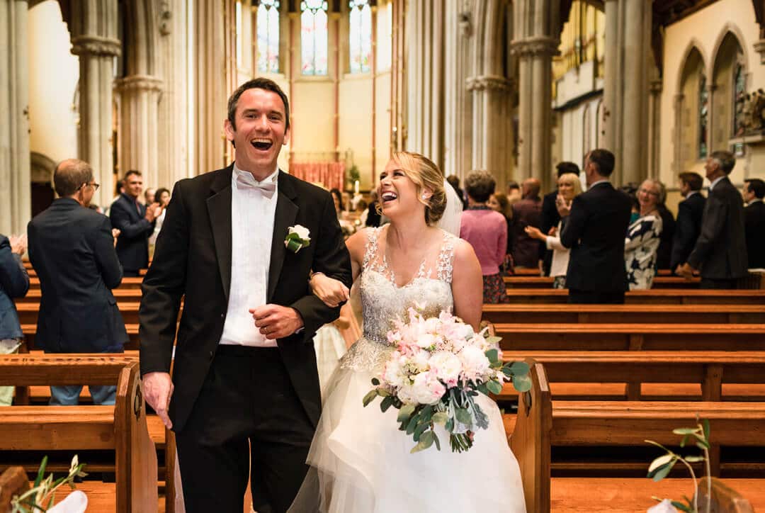 Bride and groom leaving the church after wedding ceremony