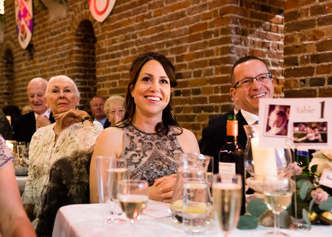 Bridesmaid reacting to speeches at Portsmouth wedding
