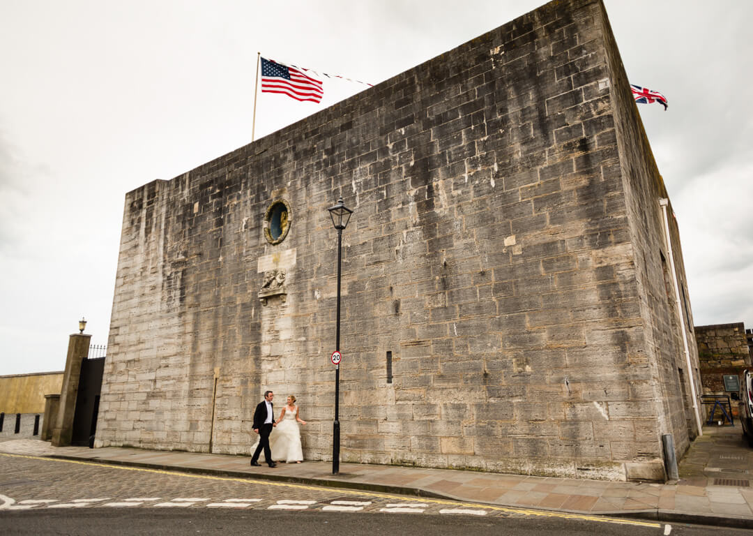 Bride and groom in front of venue at The Square Tower Wedding Portsmouth