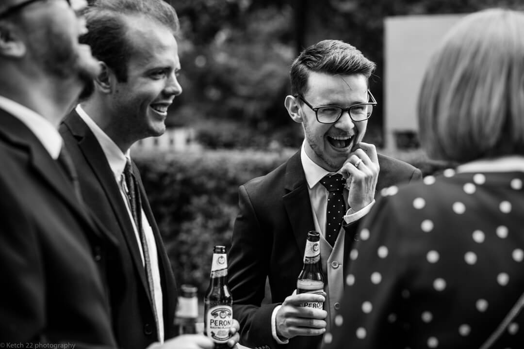 Best man laughing with beer at No 38 Wedding Cheltenham