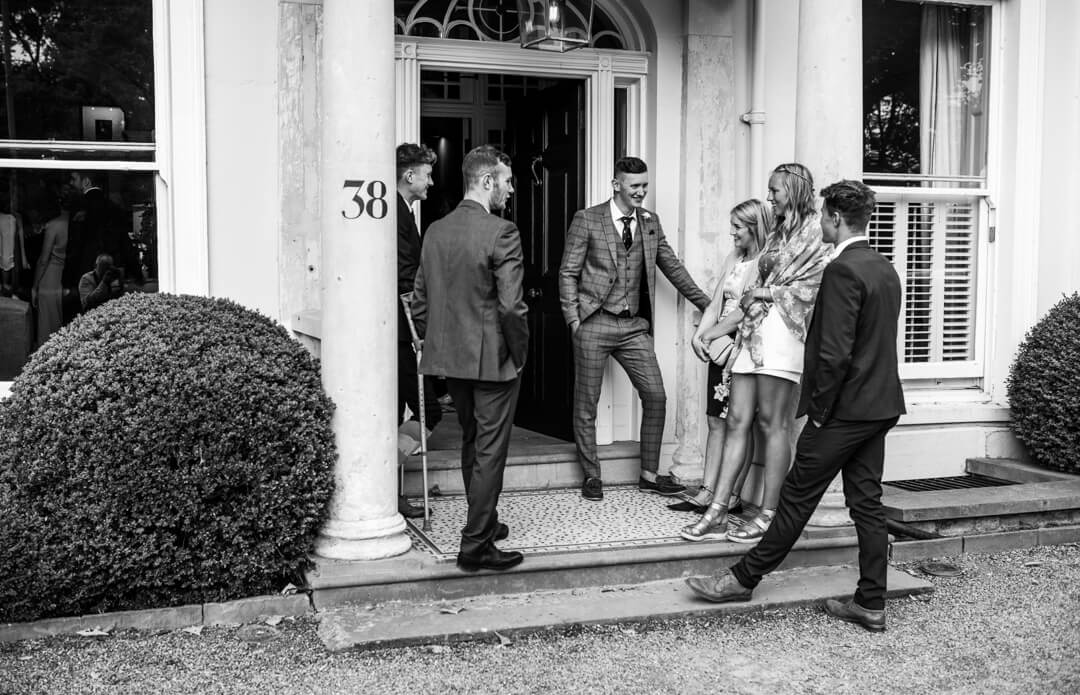 Wedding guests on the steps of No 38