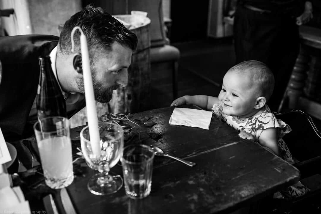 Dad and baby at wedding