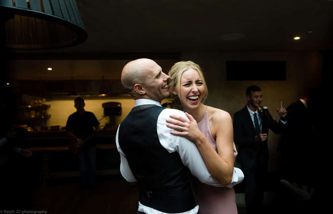 Bridesmaid dancing and laughing