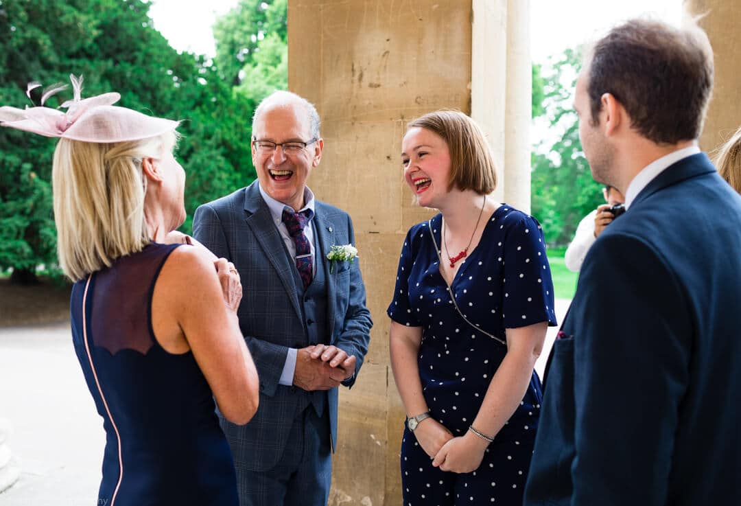 Wedding guests laughing