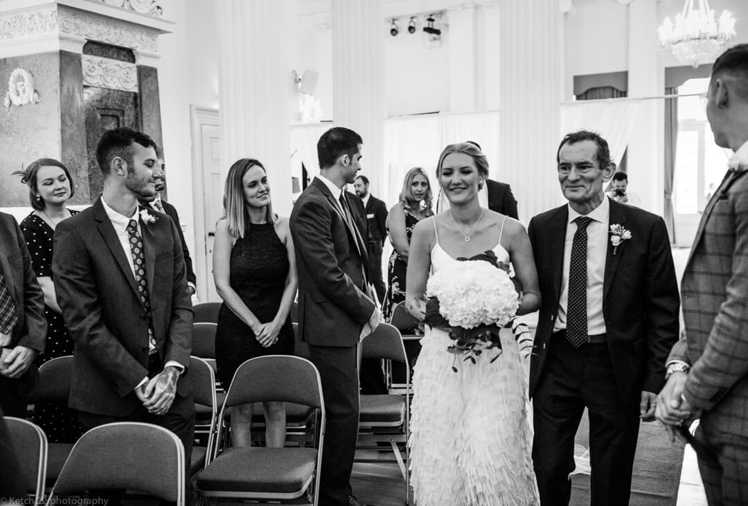 Bride and father at wedding ceremony