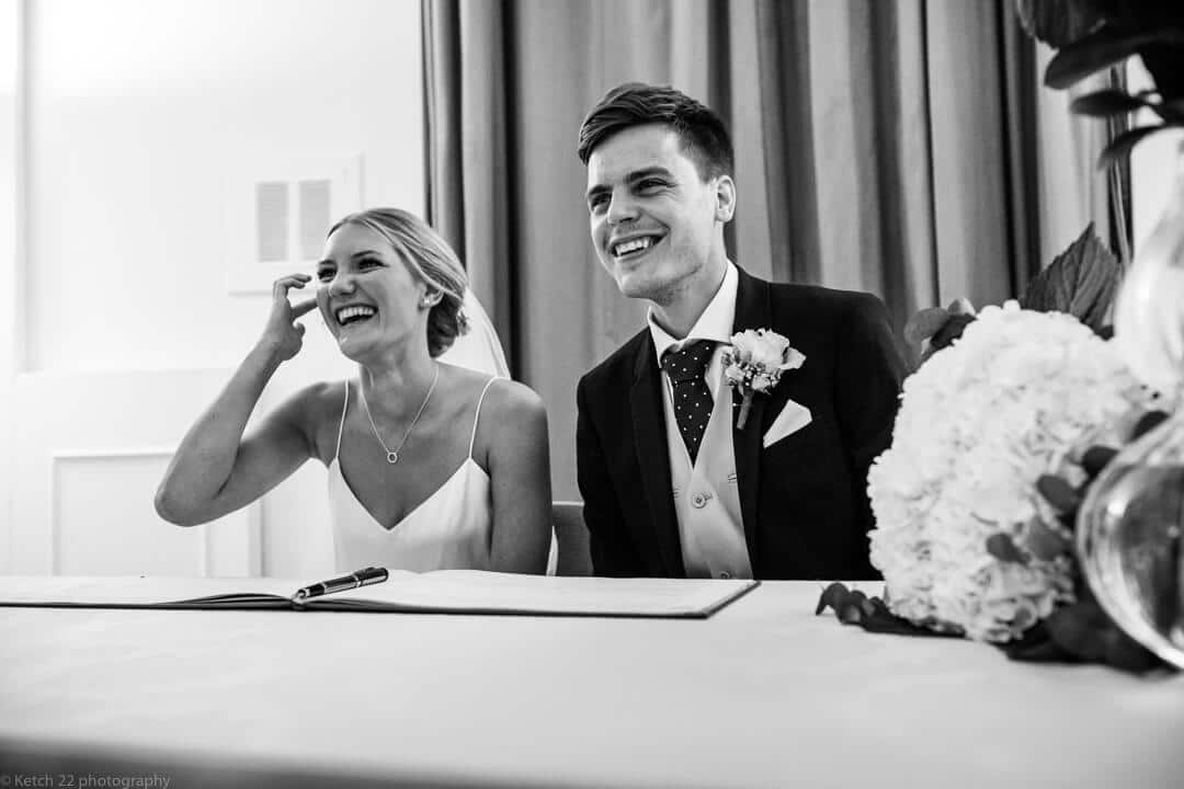 Bride and groom laughing at wedding ceremony