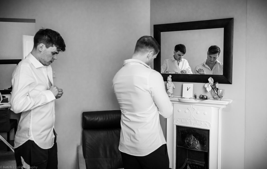 Groom and best man getting ready