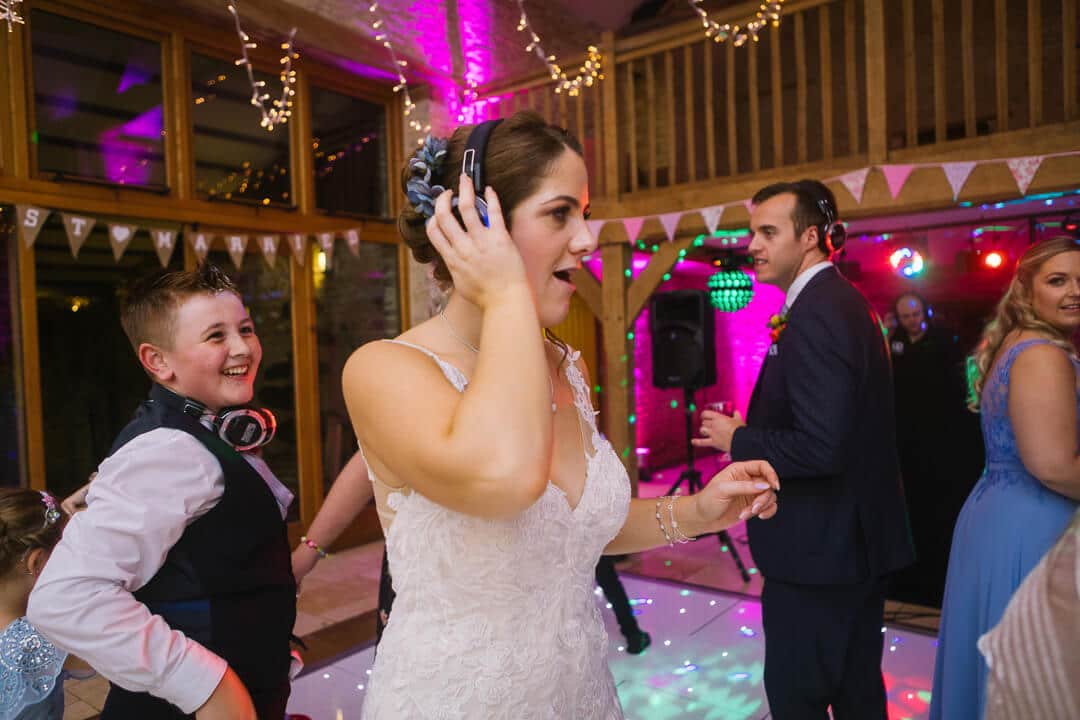 Bride dancing at Cotswold wedding