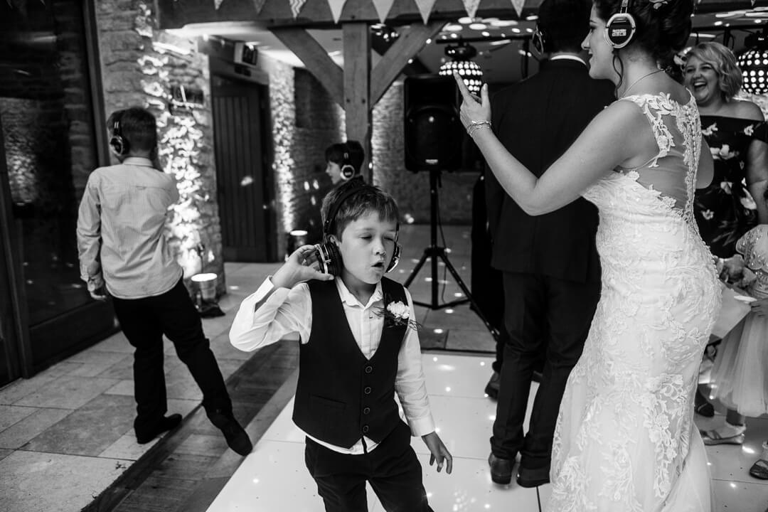 page boy dancing at Kingscote Barn wedding