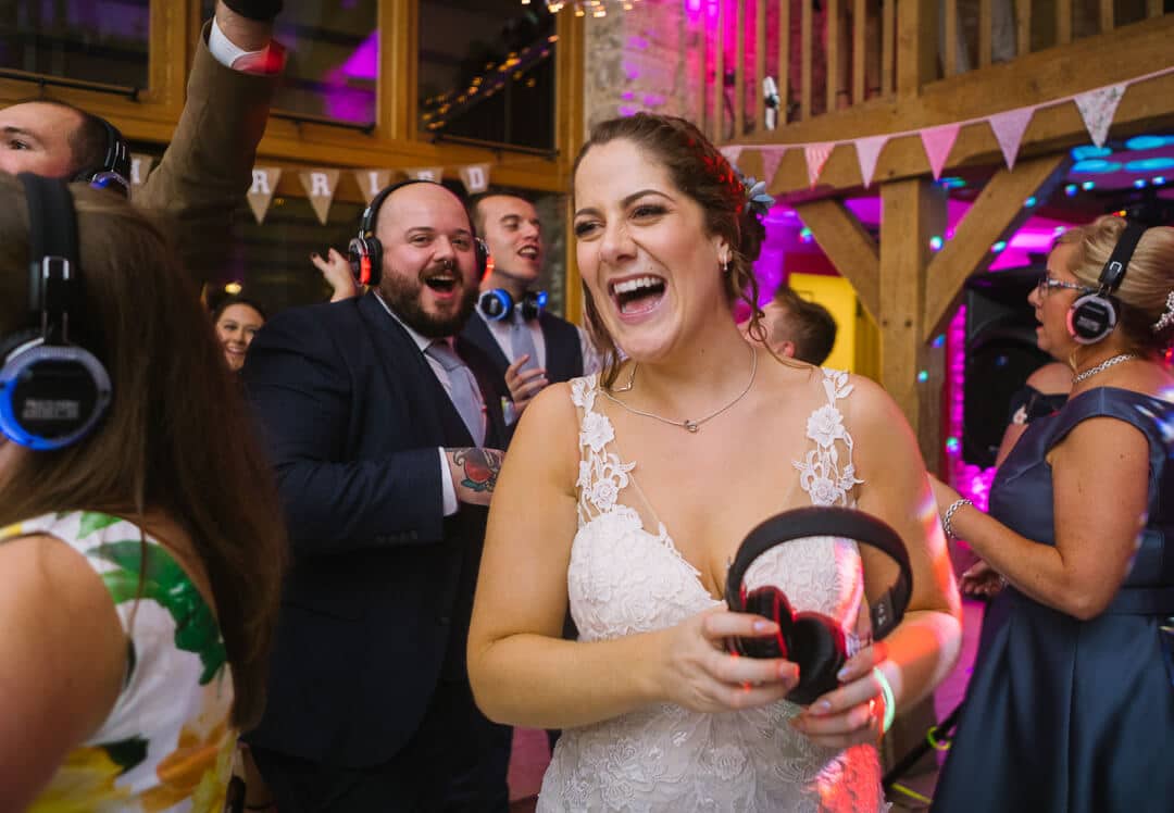 Bride laughing at evening wedding party