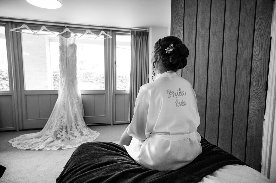 Bride looking at her dress 