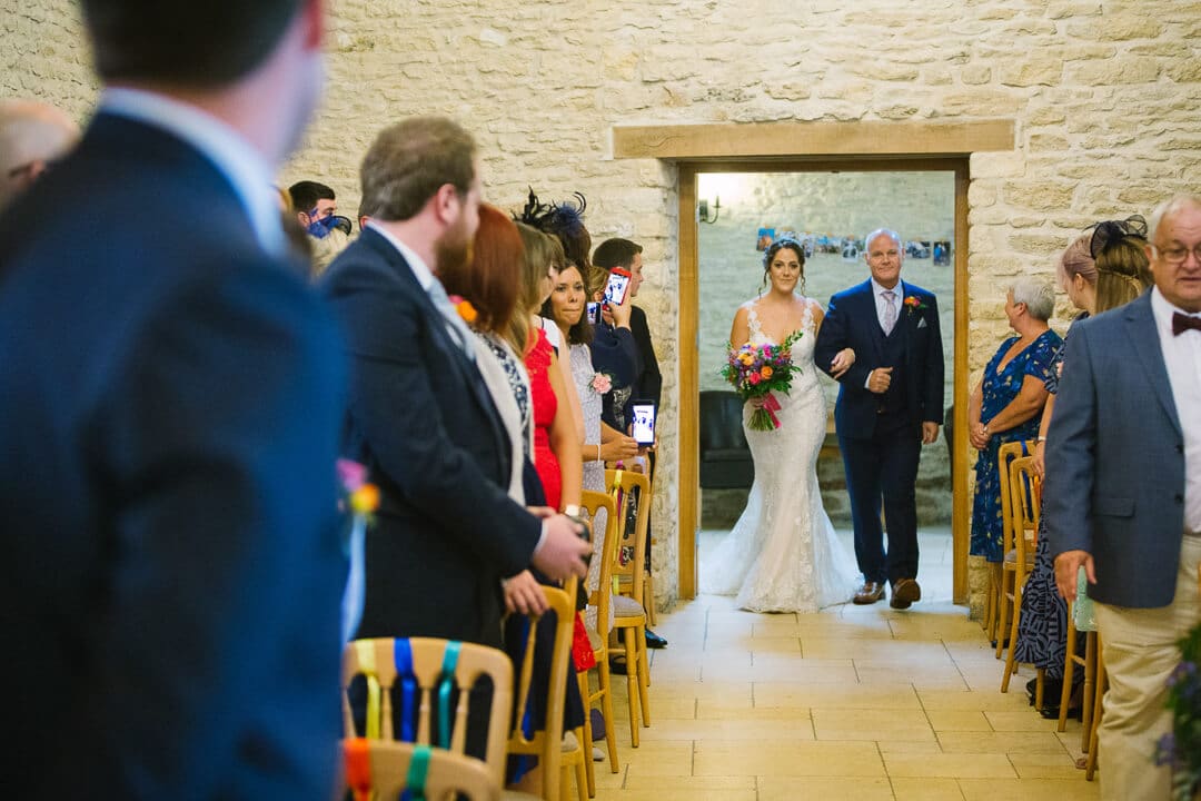 Bride and father enter wedding ceremony