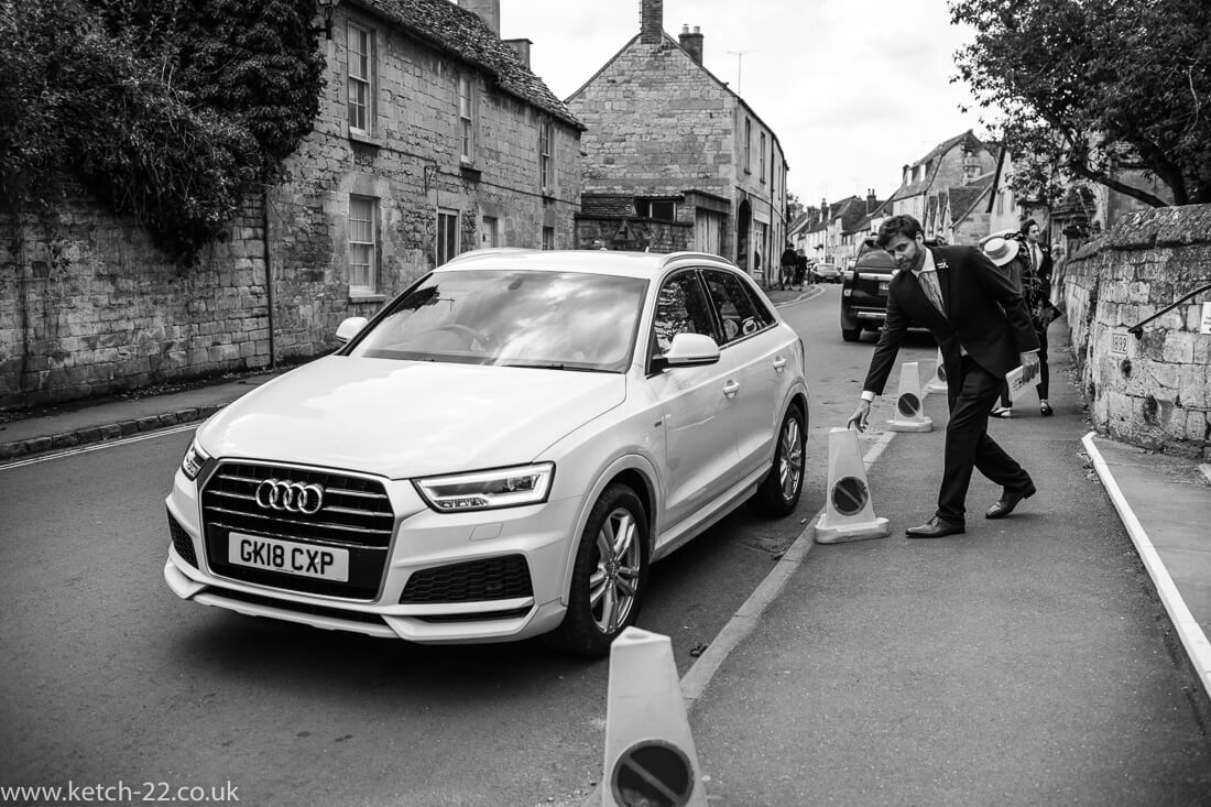 Bride arriving in white audi car